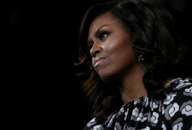 Woman fired for calling Michelle Obama an `ape in heels` to continue to work